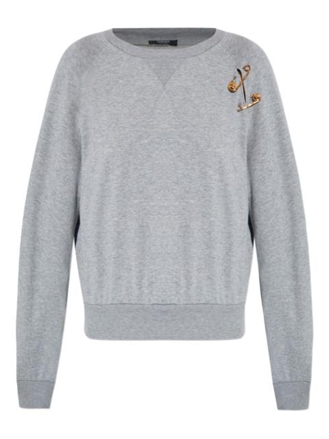 raglan-sleeve safety-pin sweatshirt