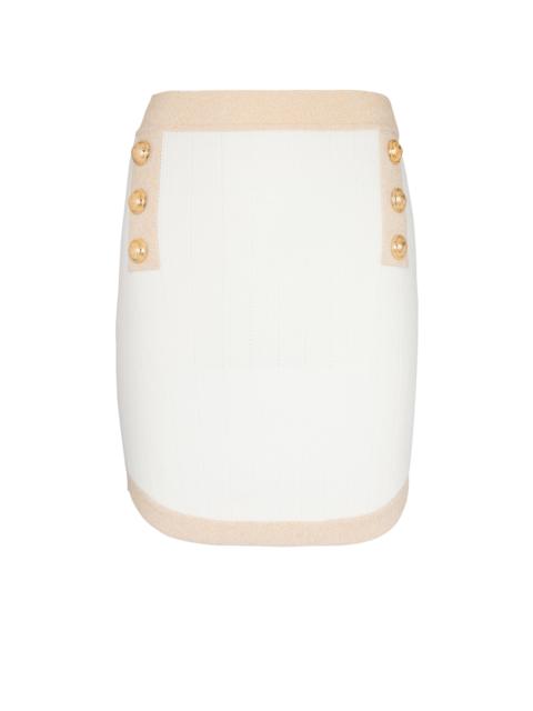 Short knit skirt with gold trim