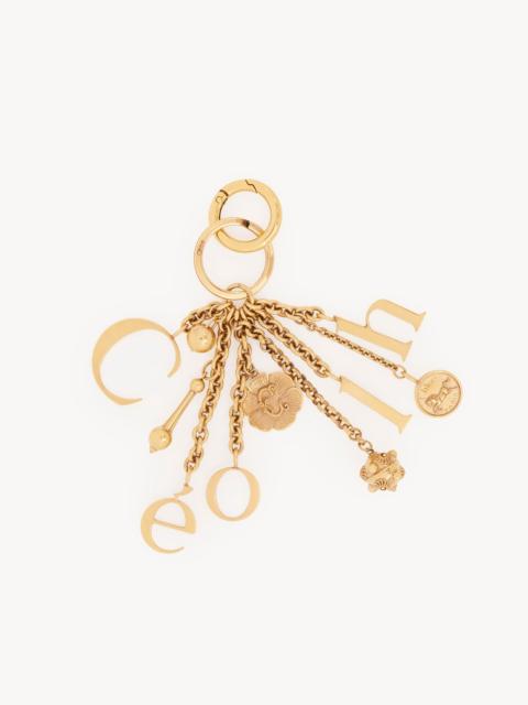 CHLOÉ SYMBOLS LOGO KEY RING BAG CHARM IN BRASS