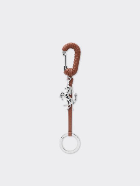 Metal and leather keyring with charm