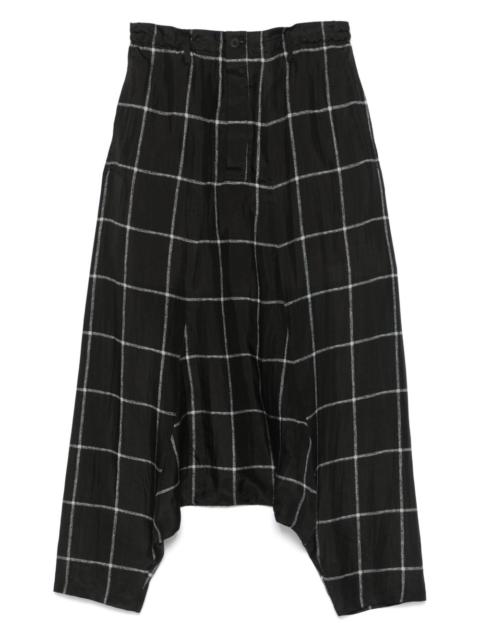 check-pattern drop-crotch trousers