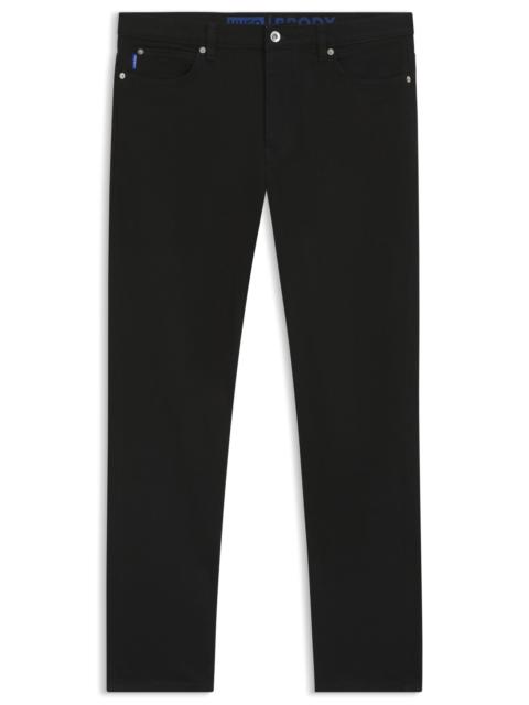 TAPERED-FIT JEANS IN BLACK STRETCH DENIM