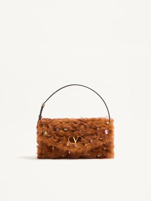 VALENTINO GARAVANI DEVAIN SMALL SHOULDER BAG IN LAMB FUR WITH RHINESTONES.