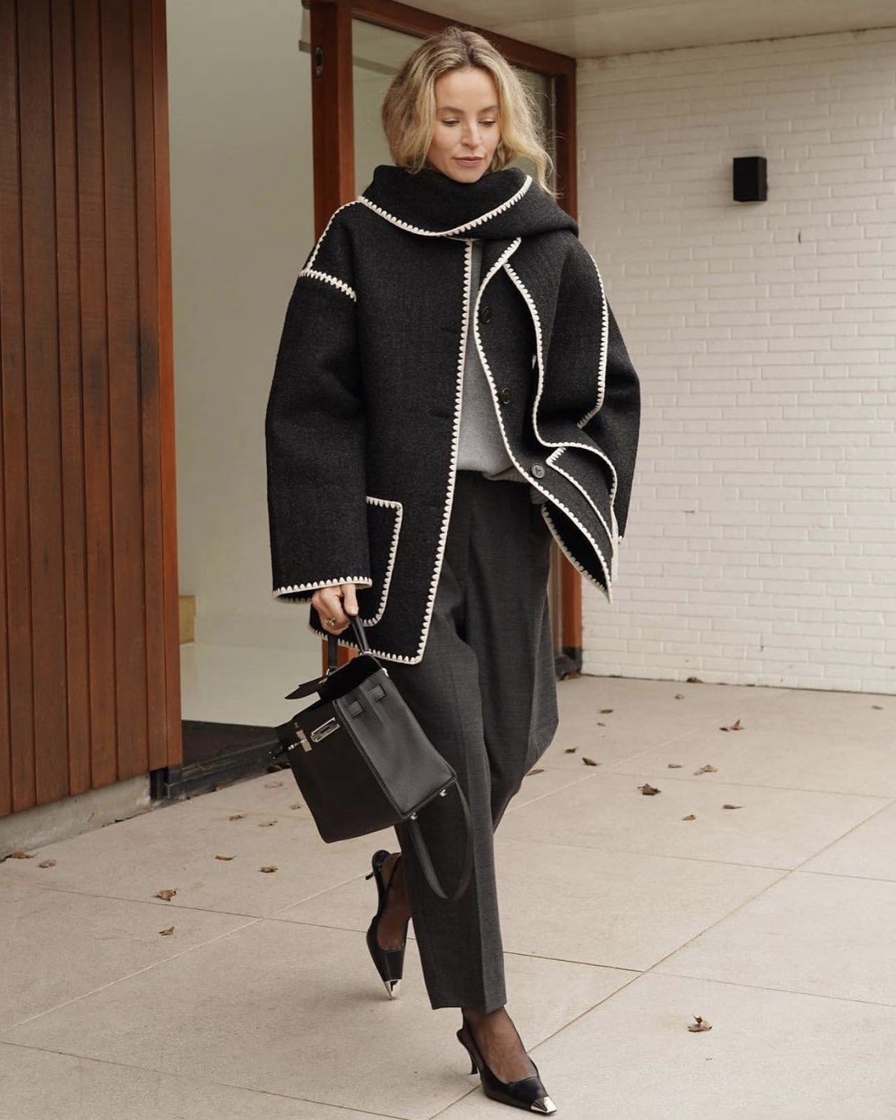Anouk Yve wearing the iconic TOTEME scarf jacket