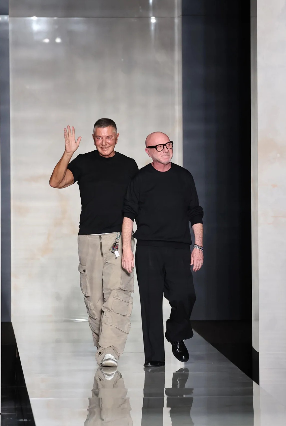 Stefano Gabbana and Domenico Dolce taking a bow at the conclusion of their Milan Fashion Week show.
