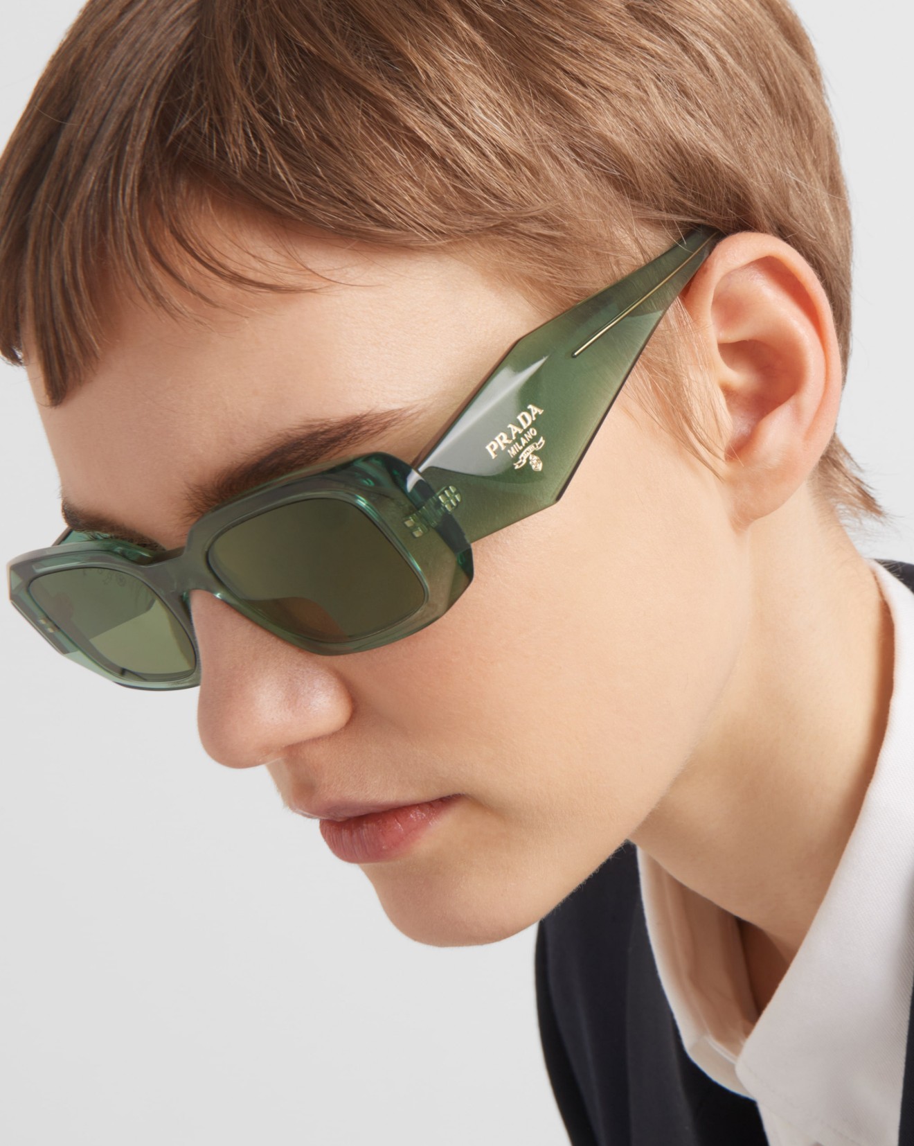 Prada Symbole PR 17WS sunglasses showcasing the enameled triangle logo on the wide temple.