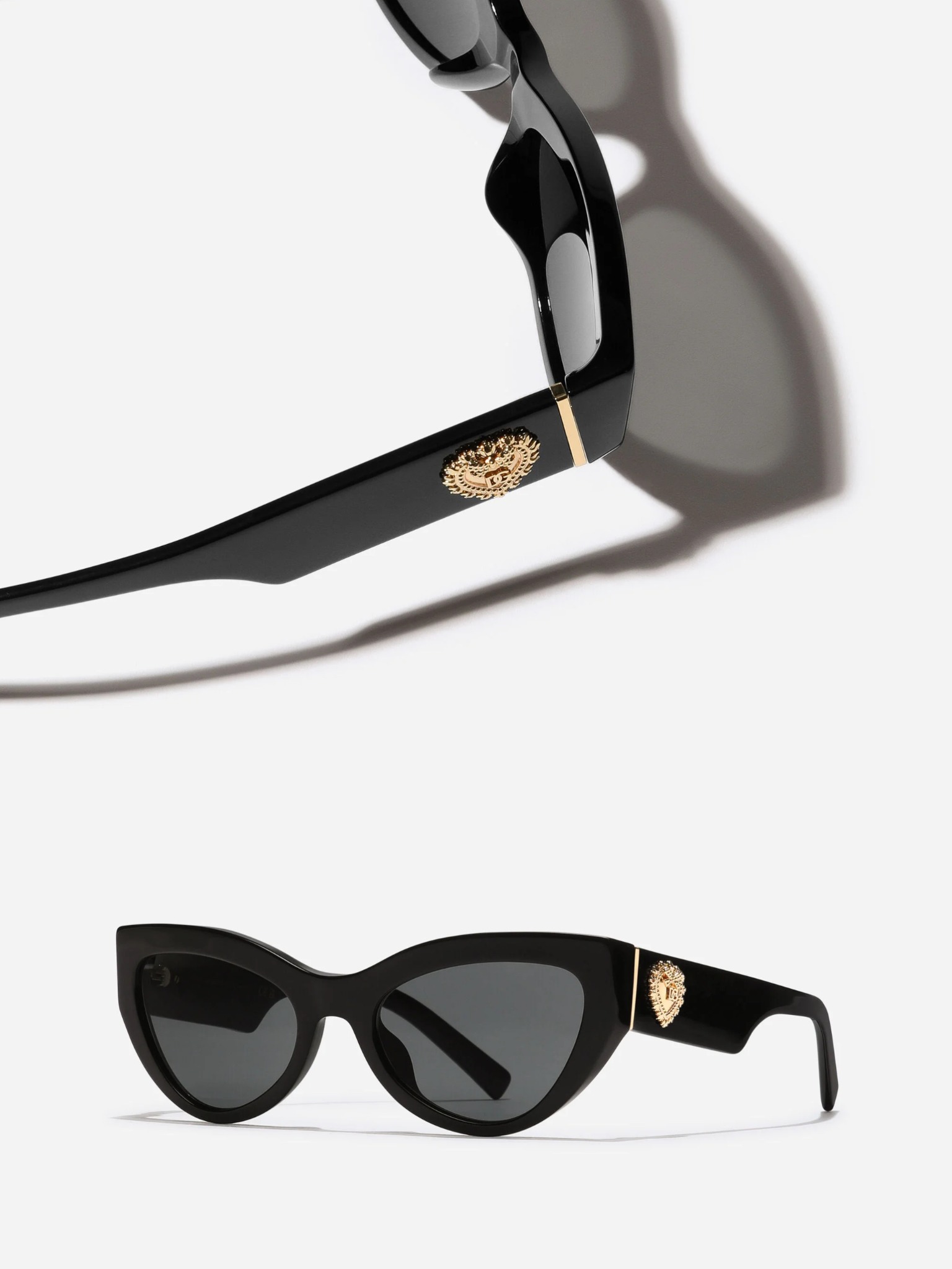 Oversized black acetate sunglasses from the Dolce & Gabbana Devotion collection featuring the Sacred Heart emblem.